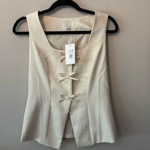 A new day beige vest with bows